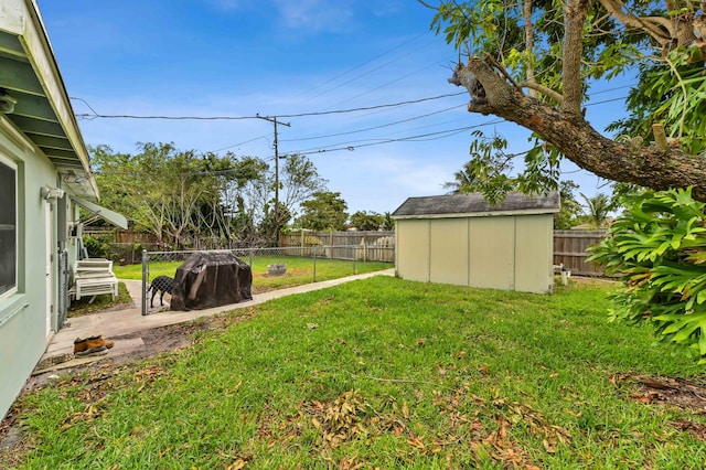 5725 Basil Dr, West Palm Beach, FL 33415 - view of yard featuring a storage unit and an outbuilding