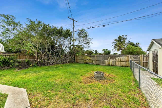 5725 Basil Dr, West Palm Beach, FL 33415 - view of yard with an outdoor fire pit