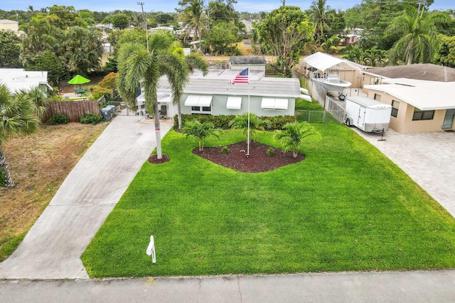 5725 Basil Dr, West Palm Beach, FL 33415 - view of front facade featuring driveway and stucco siding