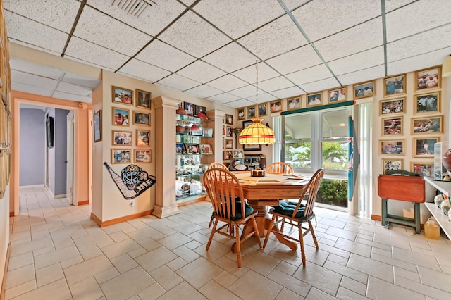 5725 Basil Dr, West Palm Beach, FL 33415 - tiled dining space featuring a drop ceiling and baseboards
