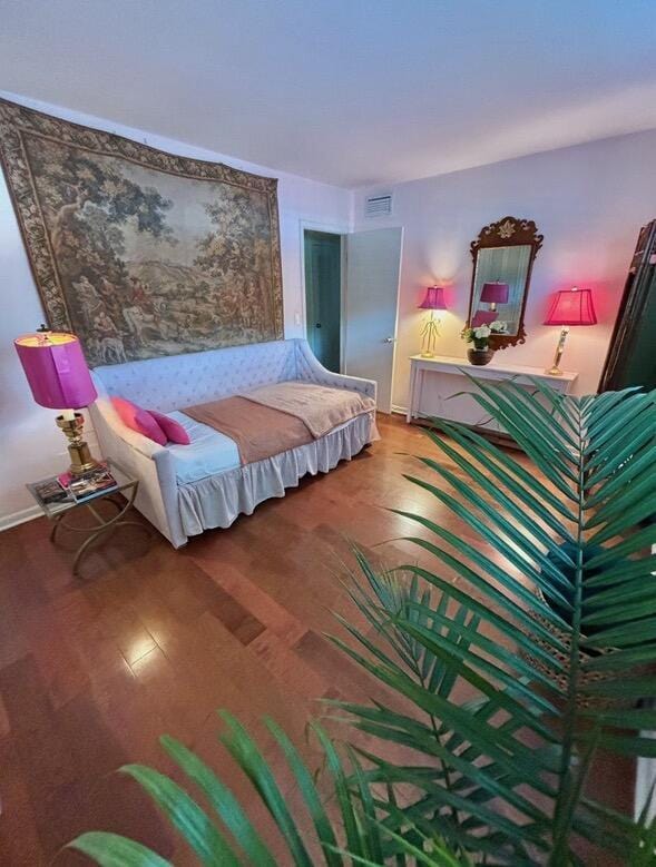 139 Sunrise Ave Unit 1050, Palm Beach, FL 33480 - bedroom with baseboards, visible vents, and wood finished floors