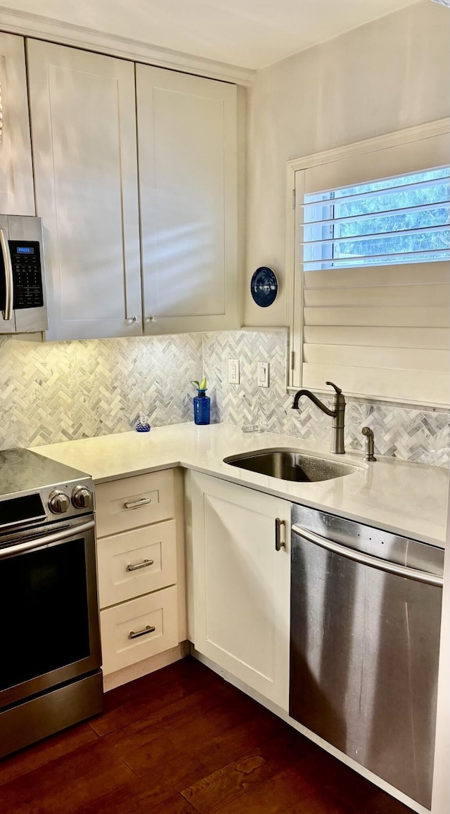 139 Sunrise Ave Unit 1050, Palm Beach, FL 33480 - kitchen featuring light countertops, white cabinetry, stainless steel appliances, and a sink