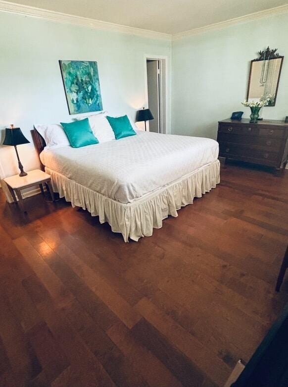 139 Sunrise Ave Unit 1050, Palm Beach, FL 33480 - bedroom featuring crown molding and wood finished floors