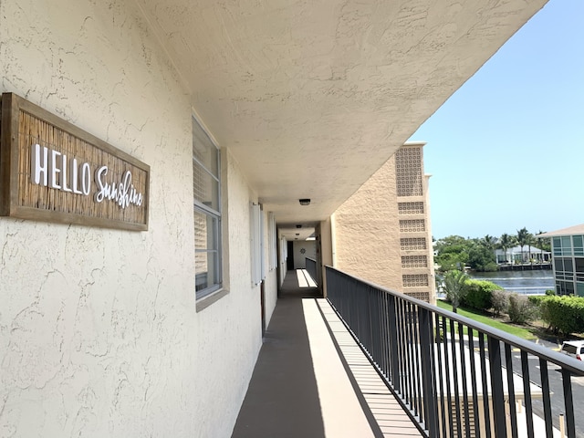balcony featuring a water view