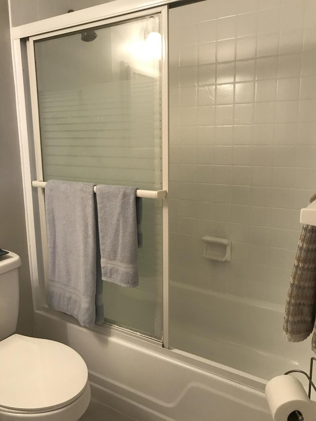 full bath featuring toilet and enclosed tub / shower combo