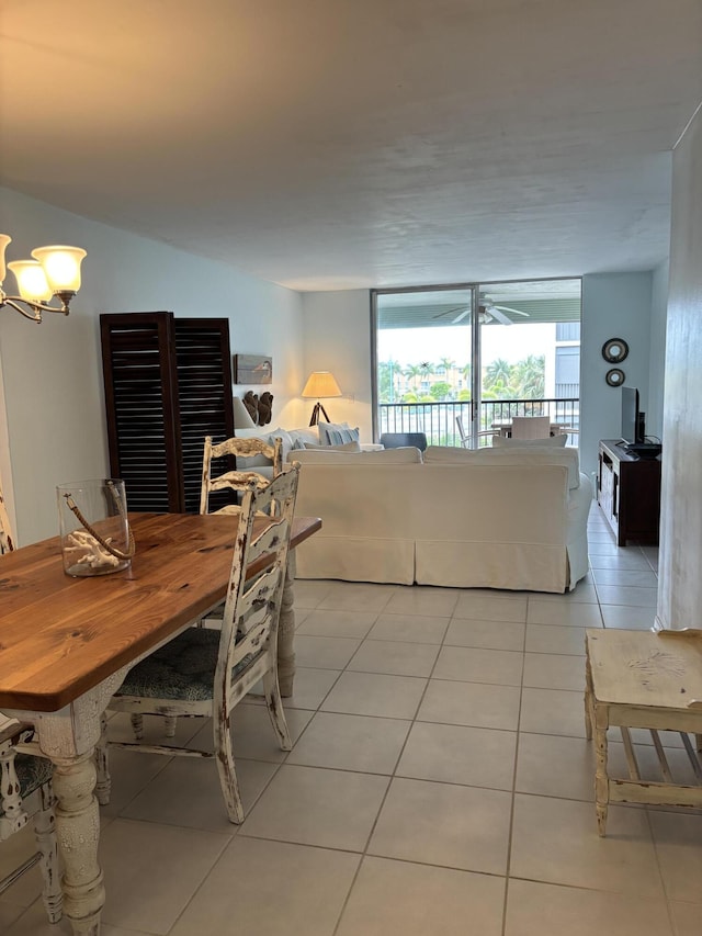 dining area featuring an inviting chandelier and light tile patterned floors