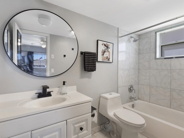 bathroom featuring shower / bathtub combination, vanity, and toilet