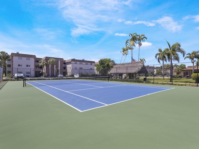 view of sport court featuring community basketball court and fence