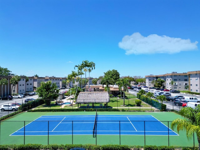 view of sport court with fence