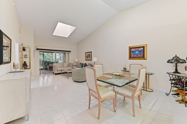 6040 Waldwick Cir, Delray Beach, FL 33484 - dining room with high vaulted ceiling, light tile patterned floors, baseboards, and a skylight