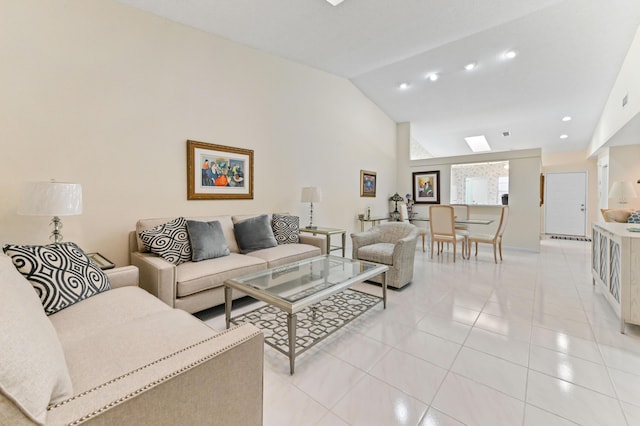 6040 Waldwick Cir, Delray Beach, FL 33484 - living room with baseboards, recessed lighting, light tile patterned floors, a skylight, and high vaulted ceiling