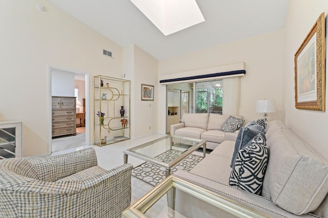 6040 Waldwick Cir, Delray Beach, FL 33484 - tiled living room with visible vents and lofted ceiling with skylight