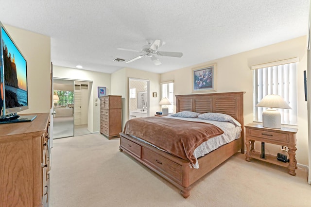 6040 Waldwick Cir, Delray Beach, FL 33484 - bedroom with visible vents, a ceiling fan, light carpet, and a textured ceiling