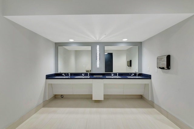 6040 Waldwick Cir, Delray Beach, FL 33484 - bathroom with double vanity, a sink, baseboards, and recessed lighting