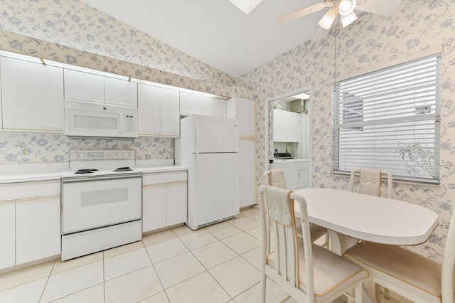 6040 Waldwick Cir, Delray Beach, FL 33484 - kitchen with washer / clothes dryer, wallpapered walls, white appliances, a ceiling fan, and lofted ceiling