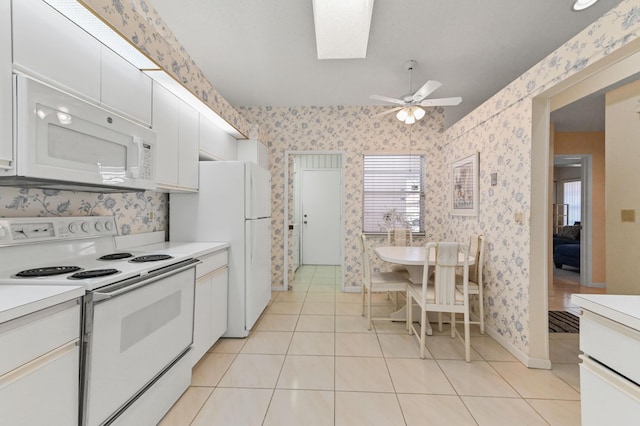6040 Waldwick Cir, Delray Beach, FL 33484 - kitchen featuring wallpapered walls, ceiling fan, and white appliances