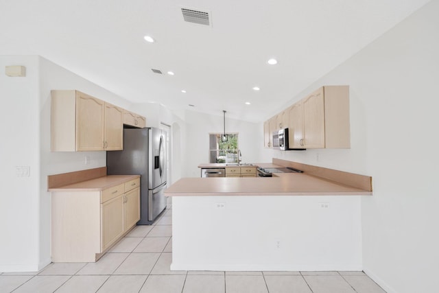 kitchen with a peninsula, visible vents, light brown cabinetry, and appliances with stainless steel finishes