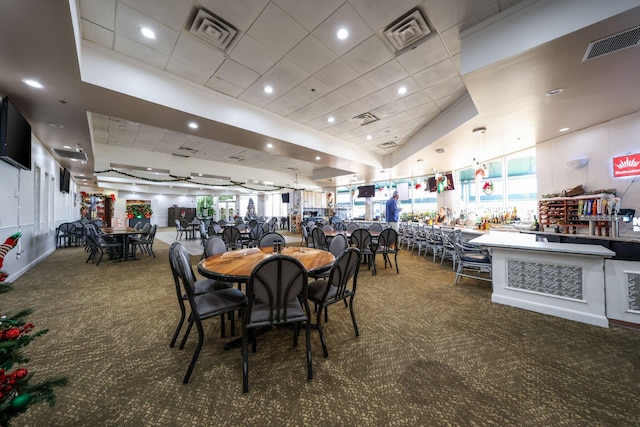 carpeted dining space with visible vents and recessed lighting