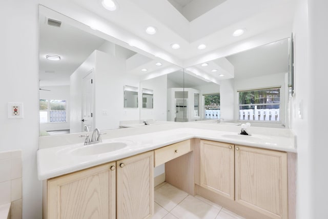 bathroom featuring a sink, recessed lighting, and double vanity