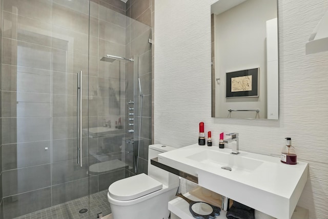 full bathroom featuring a shower stall and toilet