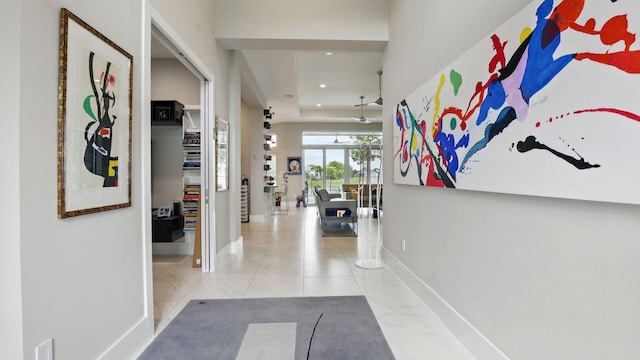 12797 Cariboo Ridge Rd, Boynton Beach, FL 33473 - hallway with baseboards, recessed lighting, a raised ceiling, and marble finish floors