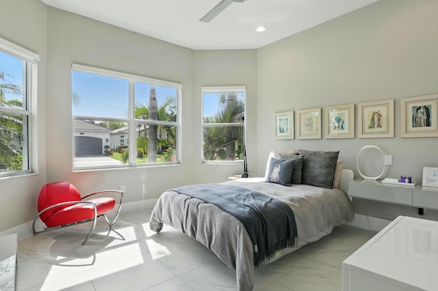 bedroom featuring recessed lighting and marble finish floor