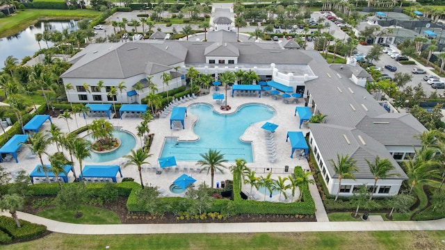 12797 Cariboo Ridge Rd, Boynton Beach, FL 33473 - drone / aerial view of a pool area and a nearby body of water