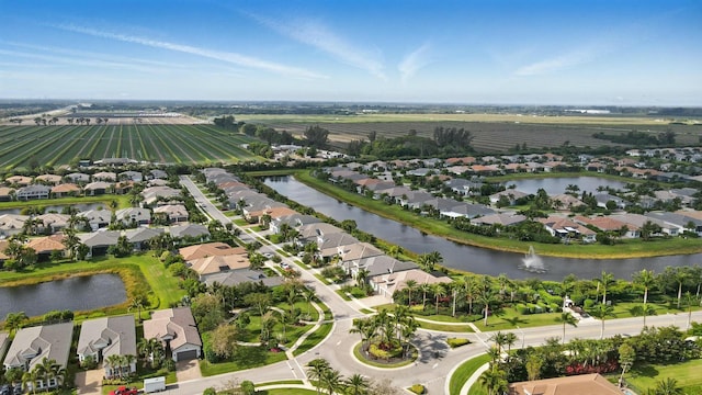 bird's eye view with a residential view and a water view