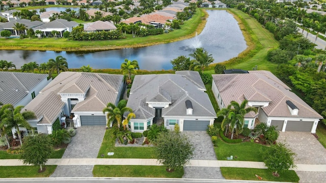 bird's eye view with a residential view and a water view