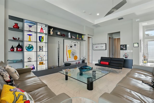 living area featuring visible vents and recessed lighting