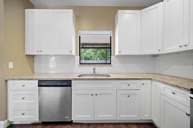 116 Churchill Dr, Royal Palm Beach, FL 33411 - kitchen featuring white cabinets, dishwasher, light stone countertops, and a sink