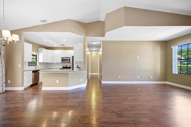 116 Churchill Dr, Royal Palm Beach, FL 33411 - kitchen with an inviting chandelier, visible vents, dark wood-type flooring, appliances with stainless steel finishes, and open floor plan