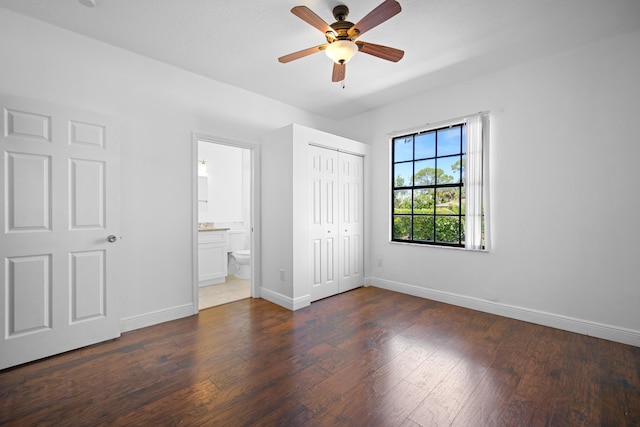 116 Churchill Dr, Royal Palm Beach, FL 33411 - unfurnished bedroom featuring a closet, connected bathroom, ceiling fan, baseboards, and dark wood-style flooring