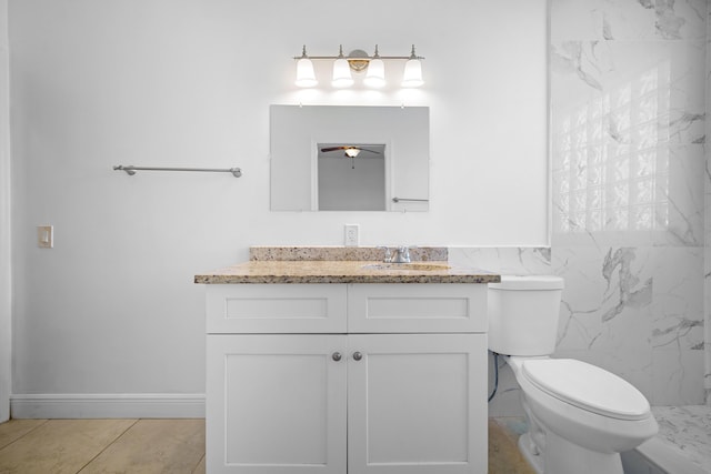 116 Churchill Dr, Royal Palm Beach, FL 33411 - bathroom featuring ceiling fan, toilet, vanity, and tile walls