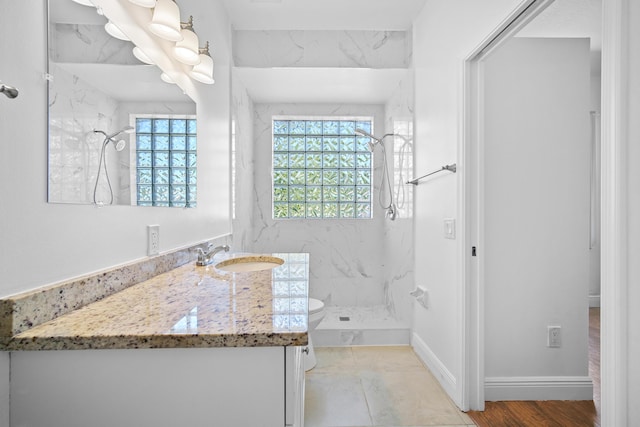 116 Churchill Dr, Royal Palm Beach, FL 33411 - bathroom with toilet, vanity, a marble finish shower, and baseboards