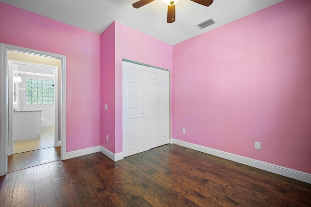 116 Churchill Dr, Royal Palm Beach, FL 33411 - unfurnished bedroom featuring baseboards, visible vents, wood finished floors, a closet, and ceiling fan