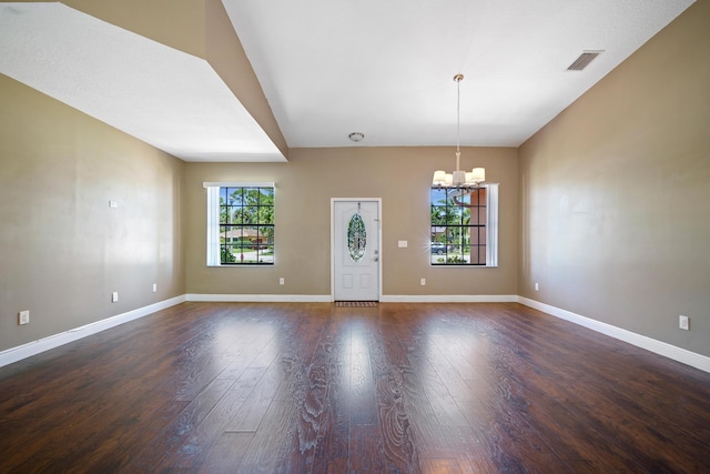 116 Churchill Dr, Royal Palm Beach, FL 33411 - interior space with dark wood finished floors, baseboards, a notable chandelier, and visible vents