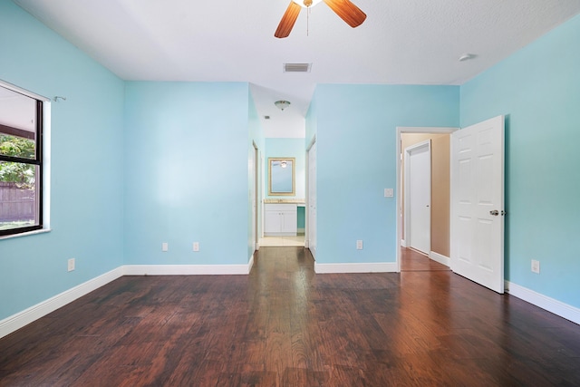 116 Churchill Dr, Royal Palm Beach, FL 33411 - unfurnished bedroom with a ceiling fan, wood finished floors, connected bathroom, baseboards, and visible vents