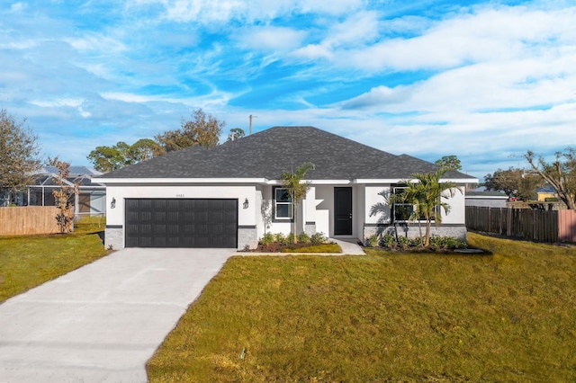 5106 Hickory Dr, Fort Pierce, FL 34982 - ranch-style house featuring an attached garage, a front yard, fence, and driveway