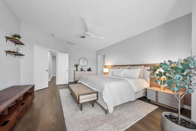 2261 Balsan Way, Wellington, FL 33414 - bedroom featuring vaulted ceiling, wood finished floors, ceiling fan, and a textured ceiling