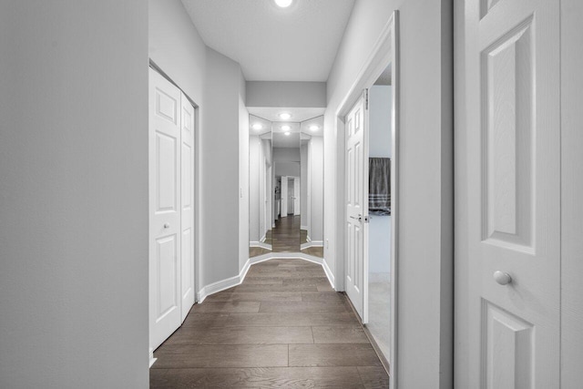 2261 Balsan Way, Wellington, FL 33414 - hallway with dark wood-type flooring, baseboards, and recessed lighting