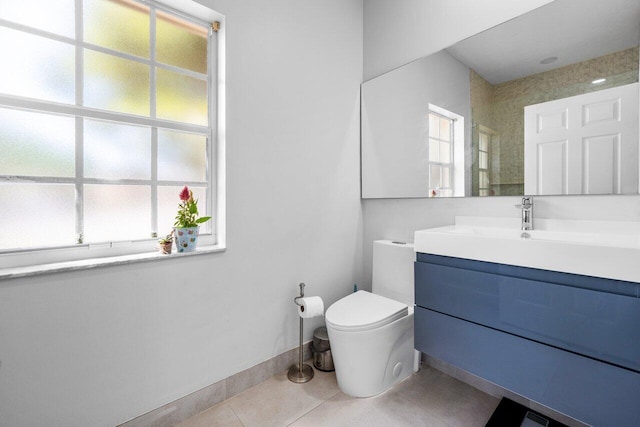 2261 Balsan Way, Wellington, FL 33414 - bathroom featuring healthy amount of natural light, toilet, tile patterned floors, and vanity