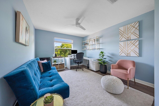 2261 Balsan Way, Wellington, FL 33414 - home office featuring ceiling fan, wood finished floors, baseboards, and a textured ceiling