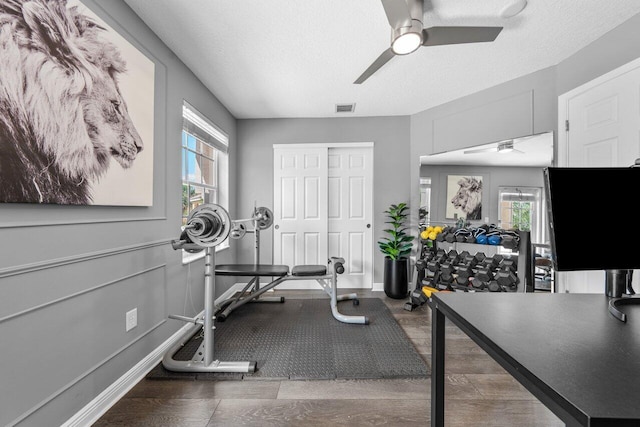 2261 Balsan Way, Wellington, FL 33414 - workout room with ceiling fan, a textured ceiling, and baseboards