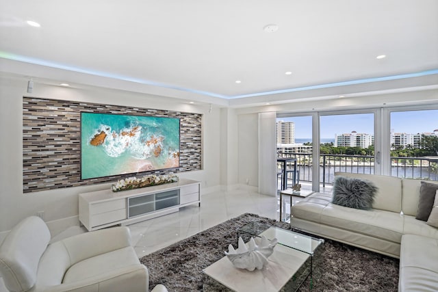 living room with baseboards and recessed lighting