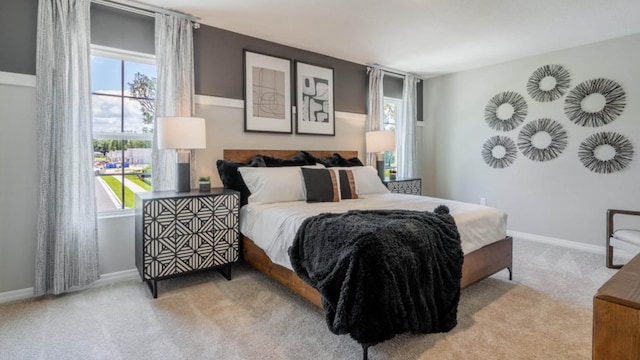 bedroom with carpet floors and baseboards