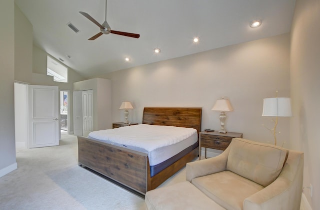 bedroom featuring high vaulted ceiling, a closet, light colored carpet, baseboards, and visible vents
