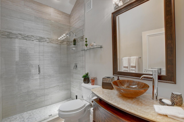 full bathroom featuring vanity, visible vents, a shower stall, and toilet
