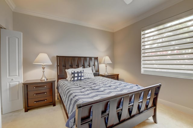 bedroom featuring light colored carpet, baseboards, and ornamental molding