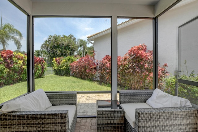 sunroom featuring an outdoor hangout area